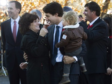 Prime Minister-designate Justin Trudeau holds his son Hadrien while hugging his mother Margaret outside Rideau Hall in Ottawa on Tuesday, November 4, 2015.