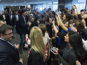 Prime Minister Justin Trudeau greets Department of Foreign Affairs staff who pack the lobby of foreign affairs headquarters in Ottawa on Friday, November 6, 2015.