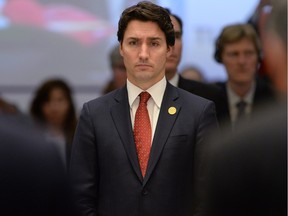 Prime Minister Justin Trudeau takes part in a moment of silence, to remember the victims of Friday's Paris attacks, at the start of a plenary session at the G20 Summit in Antalya, Turkey on Sunday, Nov. 15, 2015.