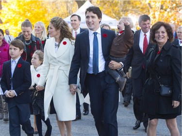 Prime minister-designate Justin Trudeau, and his wife Sophie Gregoire-Trudeau and their children Xavier, Ella-Grace and Hadrien and Trudeau's mother Margaret Trudeau walk to Rideau Hall with his future cabinet to take part in a swearing-in ceremony in Ottawa on Wednesday, November 4, 2015.