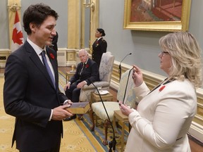 Justin Trudeau takes the oath of office as he is sworn in as prime minister of Canada at Rideau Hall in Ottawa on Wednesday, November 4, 2015.