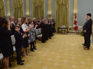 Prime Minister Justin Trudeau's son Xavier, second from left, looks at his grandmother Margaret's reaction as the new Liberal prime minister stands before his cabinet with Governor General David Johnston at Rideau Hall in Ottawa on Wednesday, November 4, 2015.