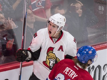 Ottawa Senators' Kyle Turris celebrates his game-winning goal as Montreal Canadiens' Jeff Petry, right, skates by during overtime NHL hockey action, in Montreal, on Tuesday, Nov. 3, 2015.