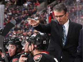 Dave Cameron gives instructions as he makes his debut behind the bench of the Ottawa Senators as head coach in an NHL game against the Los Angeles Kings at Canadian Tire Centre on December 11, 2014 in Ottawa.