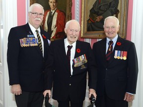 Lt.-Col. John MacIsaac, centre, photographed with Gov. Gen. David Johnston and Royal Canadian Legion Dominion President Tom Eagles on Oct. 22 at  the launch of the 2015 poppy campaign at Rideauy Hall. MacIsaac, a D-Day veteran who turned 95 the week before, died later that day.