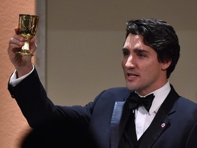 The youngest head of state of Commonwealth countries, Canadian Prime Minister Justin Trudeau, celebrates a toast in honour of Queen Elizabeth II during the gala dinner of the Commonwealth Heads of Government Meeting (CHOGM) on November 27, 2015 in Attard, Malta.
