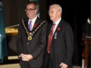 Mayor Jim Watson bestows the Order of Ottawa medal on Ottawa Senators General Manager Bryan Murray.