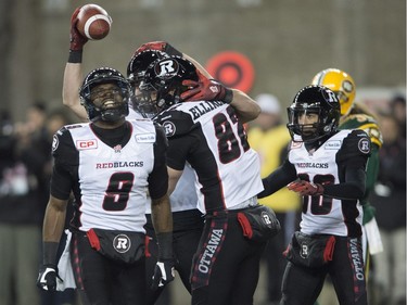 Members of the Ottawa Redblacks celebrate a touchdown during the first quarter of the 103rd Grey Cup in Winnipeg on Sunday, Nov. 29, 2015.