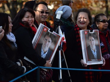 Members of the public wait on the grounds of Rideau Hall before the swearing-in ceremony ofor Prime Minister-designate Justin Trudeau in Ottawa on Wednesday, Nov. 4, 2015.