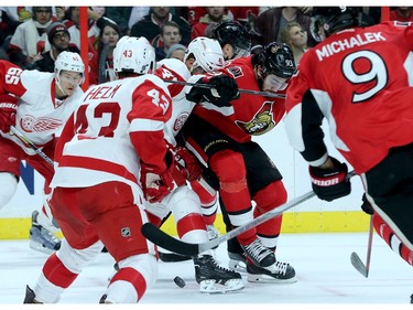 Mika Zibanejad fights for the puck from Detroit's Luke Glendenning (41) during first period action between the Ottawa Senators and Detroit  Red Wings Monday (Nov 16, 2015) at Canadian Tire Centre.