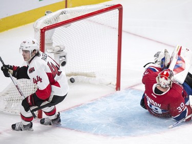 Ottawa Senators' Jean-Gabriel Pageau, left, scores a short-handed goal on Montreal Canadiens' goalie Mike Condon during second period NHL action.