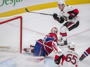 Ottawa Senators' Kyle Turris, right, scores on Montreal Canadiens' goalie Mike Condon during overtime NHL hockey action, in Montreal, on Tuesday, Nov. 3, 2015. The Senators beat the Canadiens 2-1.