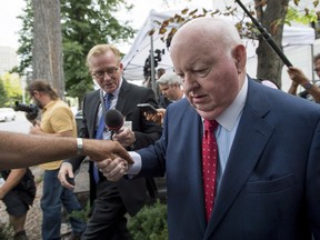 Sen. Mike Duffy, a former Conservative caucus member, leaves the courthouse in Ottawa following the second day of testimony by Chris Woodcock, former director of issues management in the Prime Minister's Office, on Tuesday, Aug. 25, 2015. The trial is expected to resume on Wednesday.