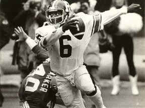 J.C Watts scrambles away from an Edmonton tackler during the 1981 Grey Cup game.