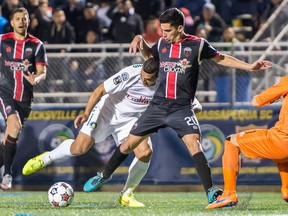 The Ottawa Fury's Mauro Eustaquio battles a Cosmos player for possession during the NASL Soccer Bowl on Sunday, Nov. 15, 2015.