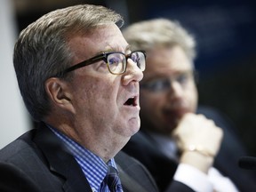 Ottawa Mayor Jim Watson, left, answers questions from the media, as city manager Kent Kirkpatrick looks on after the city's 2016 draft budget in Ottawa City Hall council chambers Thursday November 12, 2015.