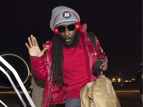 Ottawa RedBlacks Abdul Kanneh jokes about slipping the ice as he arrives in Winnipeg on Tuesday, Nov. 24, 2015. The RedBlacks will play the Edmonton Eskimos in the 103rd Grey Cup on Sunday.