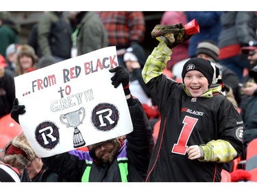 Ottawa Redblacks fans cheer during first half action in the CFL East Division final between the Hamilton Tiger-Cats and the Ottawa Redblacks in Ottawa, Sunday November 22, 2015.