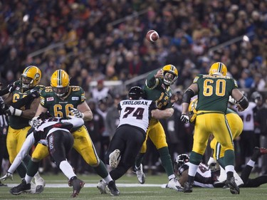 The Ottawa Redblacks' Keith Shologan (74) tackles Edmonton Eskimos quarterback Mike Reilly during the 103rd Grey Cup in Winnipeg, Man., Sunday, Nov. 29, 2015.