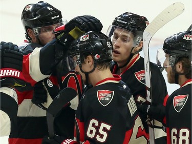 Ottawa Senators' Erik Karlsson celebrates his goal against the Columbus Blue Jackets with teammates during second period NHL action.