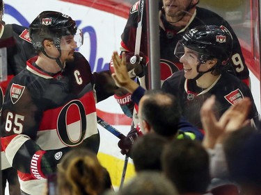 Ottawa Senators' Erik Karlsson celebrates his goal against the Columbus Blue Jackets with teammate Jean-Gabriel Pageau, right, during second period NHL action.