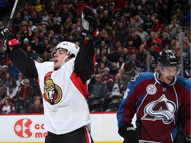 DENVER, CO - NOVEMBER 25:  Shane Prince #10 of the Ottawa Senators celebrates his second goal of the first period as Brandon Gormley #46 of the Colorado Avalanche looks on and the Senators take a 2-0 lead at Pepsi Center on November 25, 2015 in Denver, Colorado.