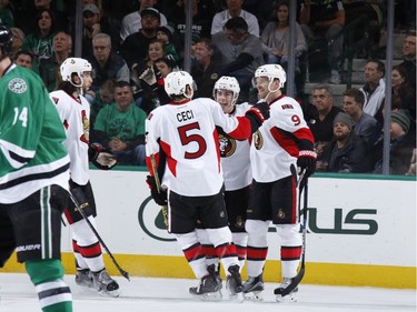 Cody Ceci #5, Milan Michalek #9, Jean-Gabriel Pageau #44 and the Ottawa Senators celebrate a goal.