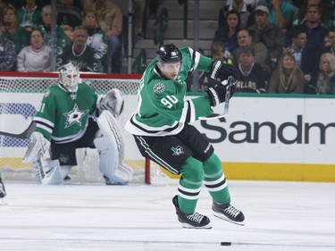 Jason Spezza #90 of the Dallas Stars handles the puck.