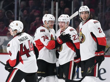 The Ottawa Senators celebrate after scoring a goal against the Montreal Canadiens.