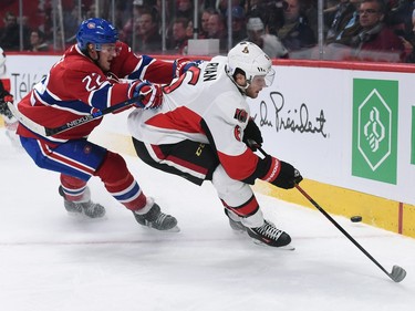 Bobby Ryan #6 of the Ottawa Senators controls the puck against Dale Weise #22 of the Montreal Canadiens.