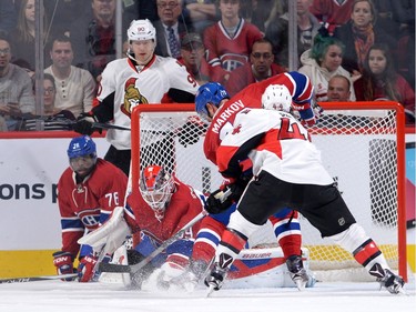 Mike Condon #39 of the Montreal Canadiens stops a shot by Jean-Gabriel Pageau #44 of the Ottawa Senators.