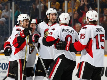 Zack Smith #15 of the Ottawa Senators celebrates his goal with teammates against the Nashville Predators.