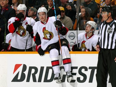 Mark Stone #61 of the Ottawa Senators jumps over the boards onto the ice during the first period.