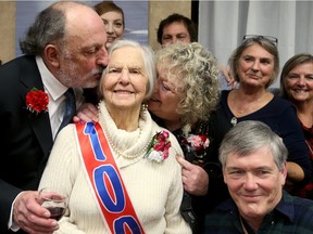 More than 100 friends and relatives packed into Park Place seniors residence on Tuesday to help Jean Wyatt Stevens celebrate her 100th birthday. Her son, Bob Stevens, 71, left, and daughter, Jenny Stevens, 70, right, weren't surprised at the turnout.