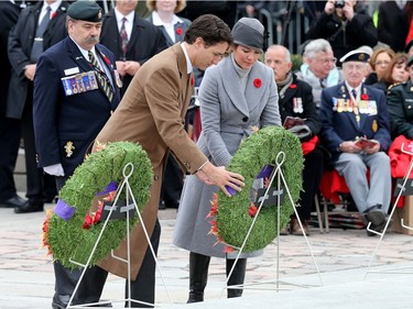 Prime Minister Justin Trudeau and his wife Sophie  Grégoire-Trudeau lay a wreath as the National Remembrance Day Ceremony takes place at the National War Memorial in Ottawa.