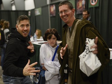 Ray Park, actor and martial artist who played Darth Maul in Star Wars pose for a photo with fans Peter and Grace who are dressed as Star Wars characters at Pop Expo.
