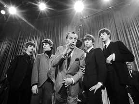 In this 1964 file photo, Ed Sullivan, centre, stands with The Beatles, from left, Ringo Starr, George Harrison, John Lennon and Paul McCartney, during a rehearsal for the British group's first American appearance on The Ed Sullivan Show. A full year before The Beatles broke through on the show, Beatlemania was burbling away in Eastern Ontario, writes Kelly Egan.