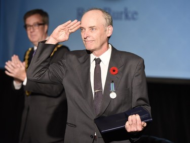 Ron Burke receives the Order of Ottawa at City Hall in Ottawa on Tuesday, November 10, 2015.
