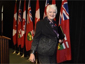 Ontario Education Minister Liz Sandals leaves a press conference after announcing tentative settlement with elementary teachers on Monday.