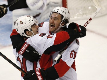 Ottawa Senators center Shane Prince, left, celebrates his goal sith with right wing Mark Stone against the Colorado Avalanche during the first period of an NHL hockey game Wednesday, Nov. 25, 2015, in Denver.