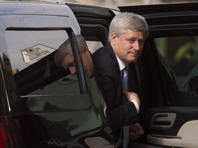 Outgoing prime minister Stephen Harper arrives at his Langevin office in Ottawa, Wednesday, Oct. 21, 2015. On his final day as prime minister, Harper reached out to a public service which his government had a tense relationship with for the last nine years. In a message sent to the entire government bureaucracy, he thanks them for the support they've shown his team over three successive Parliaments and for their dedication to the well-being of Canadians.