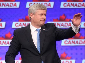 Prime Minister Stephen Harper waves to the crowd after conceding defeat at Conservative headquarters Monday night October 19, 2015.