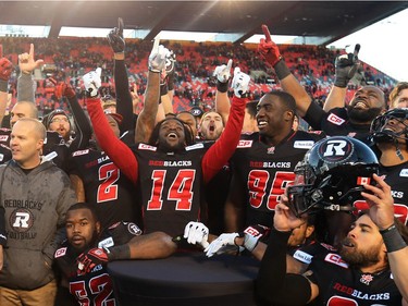 The Ottawa Redblacks celebrate their East Conference playoff win against the Hamilton Tiger-Cats at TD Place in Ottawa, November 22, 2015.