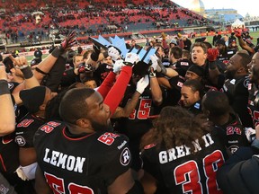 The Ottawa Redblacks celebrate their win against the Hamilton Tiger-Cats after the East Conference finals at TD Place in Ottawa, November 22, 2015.