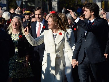 Prime Minister-designate Justin Trudeau and his wife Sophie Gregoire-Trudeau lead the new Liberal cabinet to Rideau Hall in Ottawa on Wednesday, Nov. 4, 2015. THE CANADIAN PRESS/Sean Kilpatrick
