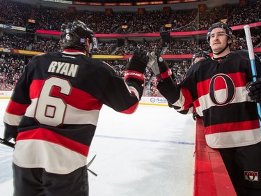 Bobby Ryan #6 of the Ottawa Senators celebrates his first period goal against  the Vancouver Canucks with teammate Mark Stone #61.