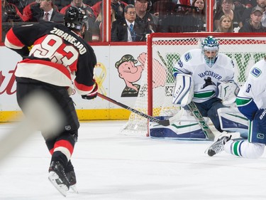 Ryan Miller #30 of the Vancouver Canucks makes a save on a wrist shot by Mika Zibanejad #93 of the Ottawa Senators.