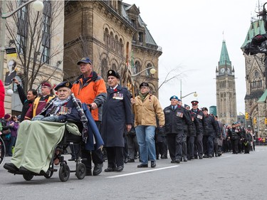 Veterans march in the parade as the National Remembrance Day Ceremony takes place at the National War Memorial in Ottawa.