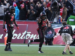 William Powell of the Ottawa Redblacks celebrates  his touchdown against the Hamilton Tiger-Cats during first half of the East Conference finals at TD Place in Ottawa, November 22, 2015.