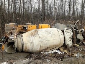 Workers were trying Monday morning to remove a cement truck that crashed and rolled into the ditch on a Highway 7 ramp to the westbound Highway  417.